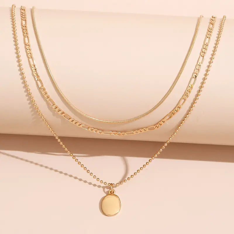 Step back in time with the Vintage Geometric Metal Oval Pendant Necklace!