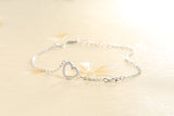 Tiny diamond-studded heart bracelet